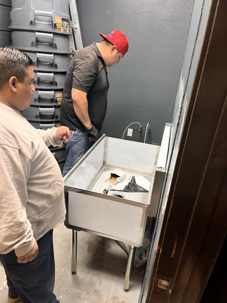 Commercial plumbing and sink installation in Grand